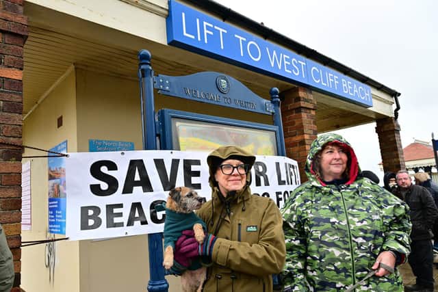 Protesters gather by the cliff lift. photo: Richard Ponter
