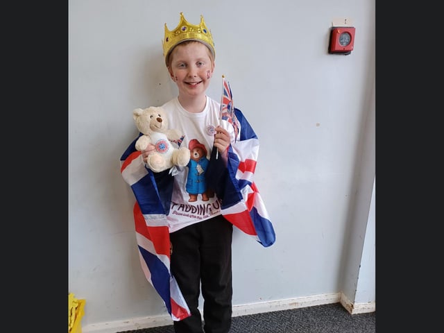 Children dressed in patriotic clothing to celebrate the coronation