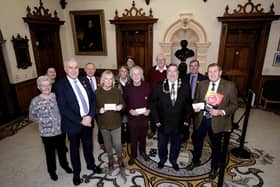 Festive Spectacular presentation at The Town Hall - organiser Nigel Wood presents the cheques..with beneficiaries Sue Deighton from SENSE, Barry Foster East Coast Motor Neurone Disease Society, Mayor Eric Broadbent and Stephen Slade representing the YMCA - pictured with supporters of the charities