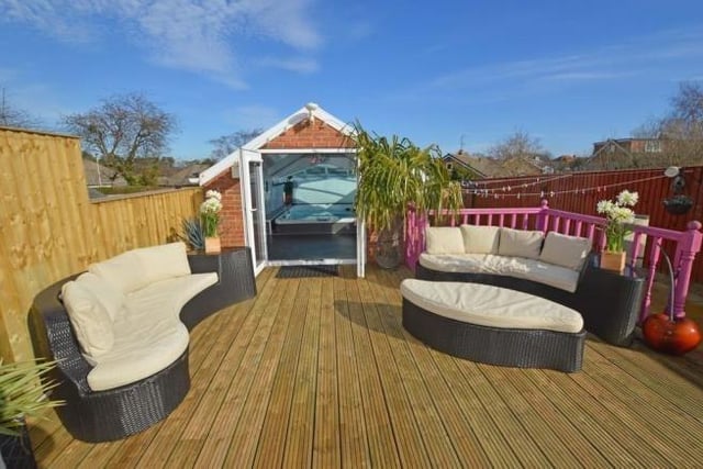 A deluxe spa pool accessed from a decked seating area in a private garden is one of the facilities with this property for sale in Newby.