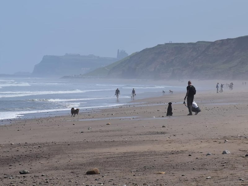 Beach walkers in Whitby.
picture: Helen Johnston