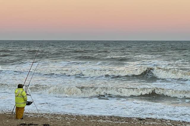 Debra Clark-Kachlon frames a beach fisherman.