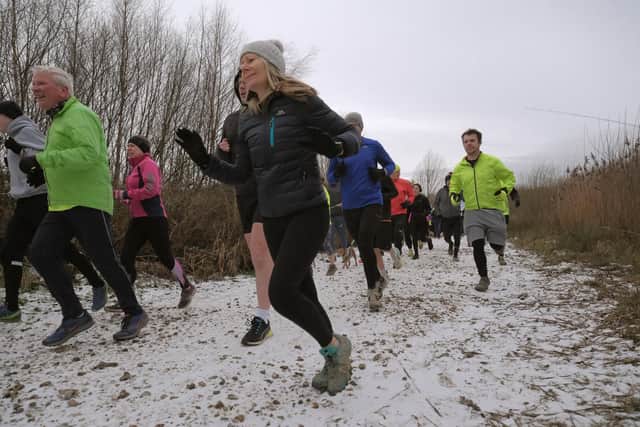 The runners tackle the wintry conditions at North Yorkshire Water Park. Photos by Richard Ponter