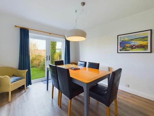 The dining room has French doors out to the garden.