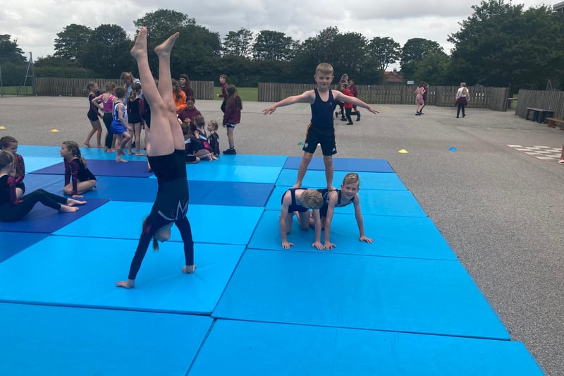 Gymnastics coach Jo Ward has been teaching gymnastics at the school for 25 years. She puts in a lot of time and passion teaching the gymnasts a variety of dance, acrobatics and gymnastics.