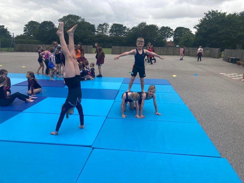 Gymnastics coach Jo Ward has been teaching gymnastics at the school for 25 years. She puts in a lot of time and passion teaching the gymnasts a variety of dance, acrobatics and gymnastics.