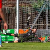 Whitby Town keeper Nicholas Cranston saves a Beverley Town shot in the first Blues game of the pre-season.