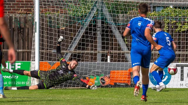 Whitby Town keeper Nicholas Cranston saves a Beverley Town shot in the first Blues game of the pre-season.