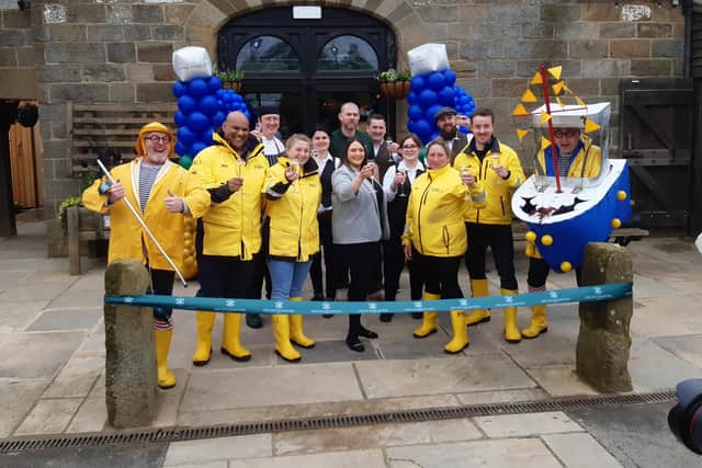 The Stables team celebrate the restaurant reopening with the RNLI and the Bread and Butter Theatre Company.