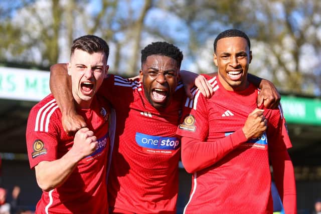 From left, Luca Colville, Kieran Weledji and Kole Hall celebrate the comeback win at King's Lynn Town. PHOTO BY ZACH FORSTER