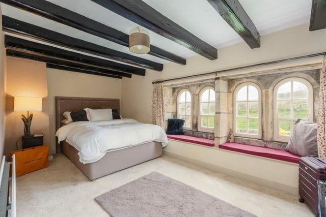 Another attractive double bedroom with feature windows and window seats.
