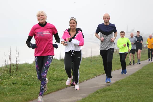 Runners battle their way through the mist during the clifftop stage of the Sewerby Parkrun on Saturday morning.