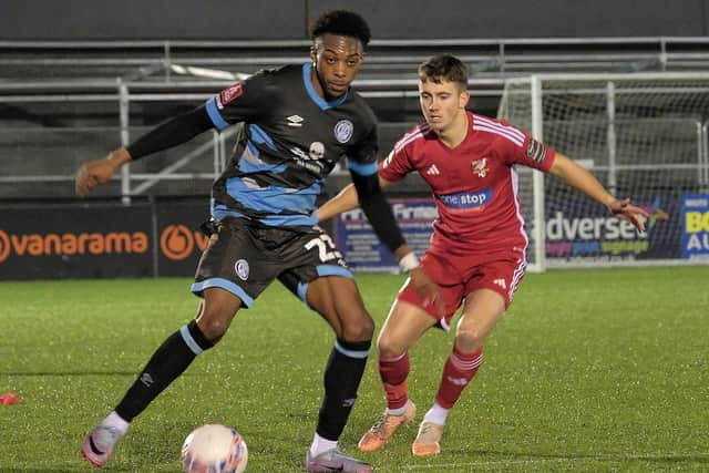 Boro sub Lewis Maloney closes in on Rovers' Tyrese Omotoye.