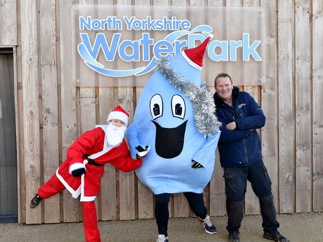 James Whitehead and the Water Park Mascot get ready with Santa
picture: Richard Ponter, 2251350d