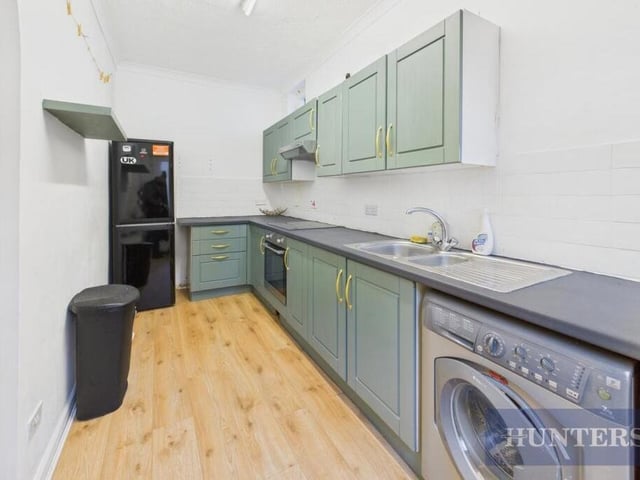 The kitchen has fitted units at base and eye level.
