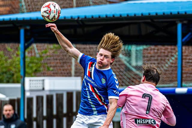 Ben Creamer, who has signed on dual-registration with Northallerton Town, challenges a Curzon player..   Photo by Brian Murfield