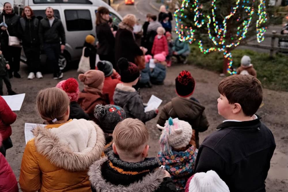 Around 100 people sing Christmas songs at Lythe common, near Whitby.