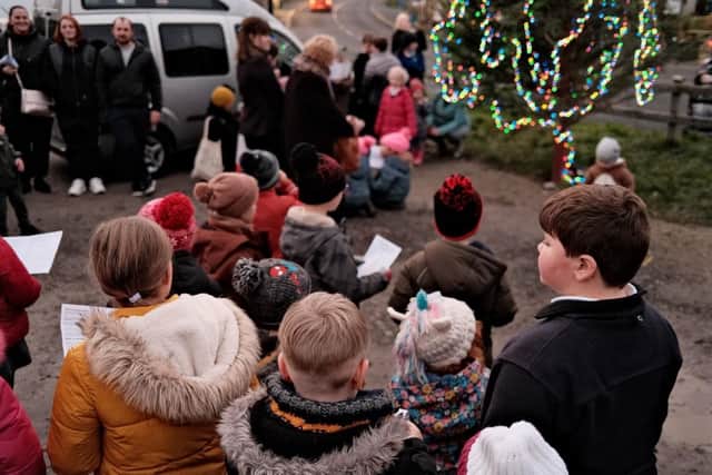 Around 100 people sing Christmas songs at Lythe common, near Whitby.