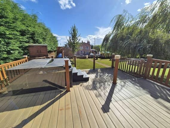 Looking towards the house from the log cabin decking.