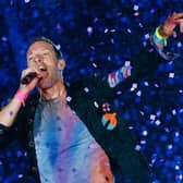 Chris Martin from Coldplay. The British rock band are set to headline Glastonbury Festival on Saturday night, but will the weather hold out for fans attending the festival? (Credit: Getty Images)