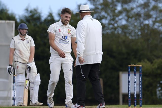 The Flixton 2nds bowler Rich Malthouse has a chat with the umpire
