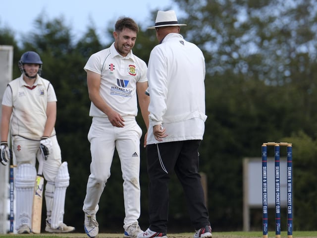The Flixton 2nds bowler Rich Malthouse has a chat with the umpire
