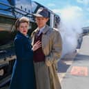 Anne-Marie Piazza and Pete Ashmore, who play Laura and Alec in the Stephen Joseph's production of Brief Encounter, with the LMS Royal Scot Class 46115 Scots Guardsman at Scarborough Railway Station