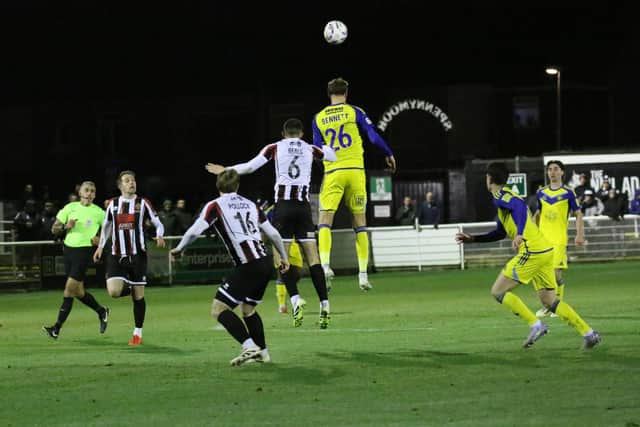 Richie Bennett rises high to win a header for Boro at Spennymoor. Photo by Jack Boys