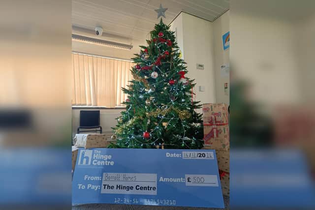 The Barratt Homes Yorkshire East cheque to The Hinge Centre.