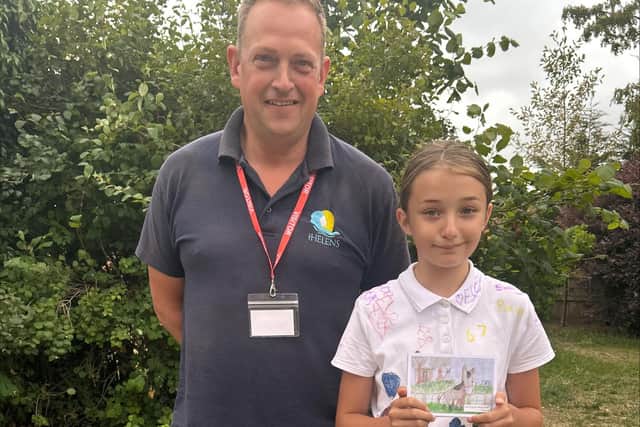 Competition winner Georgia with St Helen’s site manager Simon Roe