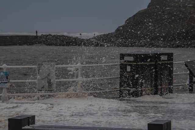 Waves pound Whitby west pier. picture: Deborah McCarthy