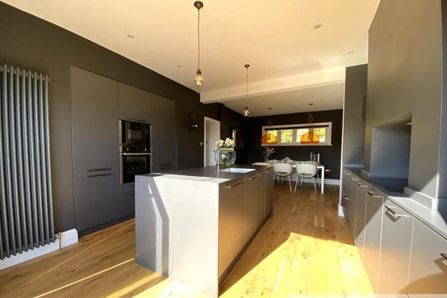 A deluxe modern kitchen with dining space.