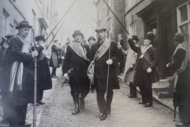 The Loyal Order of Ancient Shepherds on the Shepherds Walk in the 1930s, each carrying their shepherds' crook.