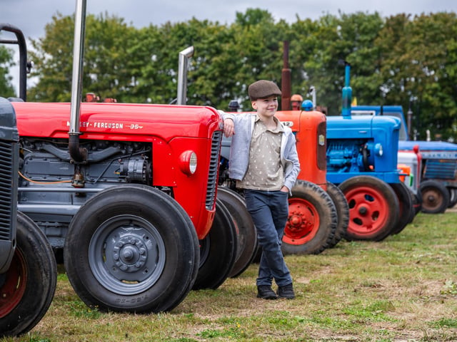 Harry Stephenson, aged 8, of York, next to a Massey Ferguson 35 Tractor.