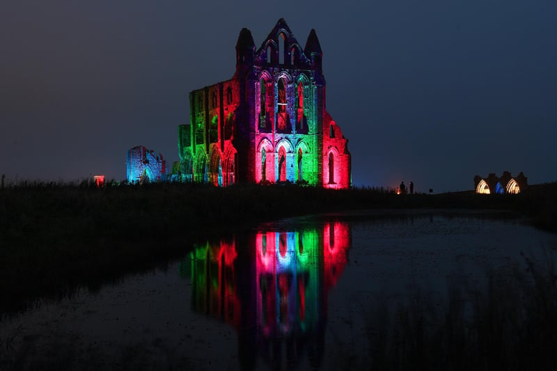 Lit up Whitby Abbey reflects in the site's pond.
picture: Jonathan Gawthorpe.