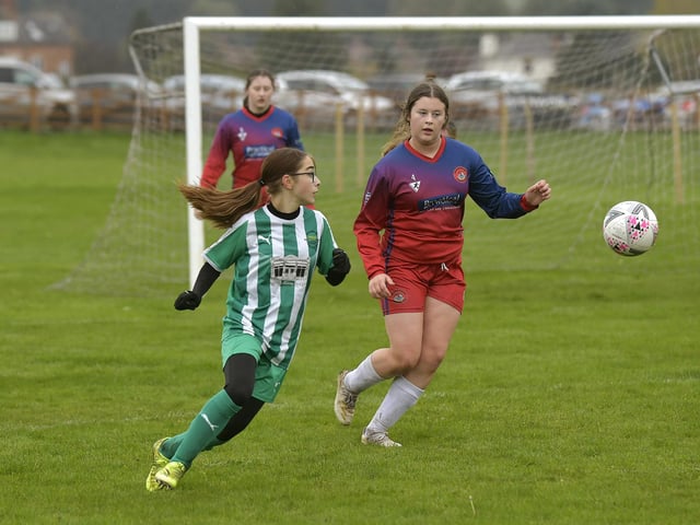 Defender Ava Hutchings keeps an eye on a Wigginton forward
