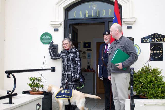 Madeleine Waplington with the plaque. Photo taken by Ian Ellis