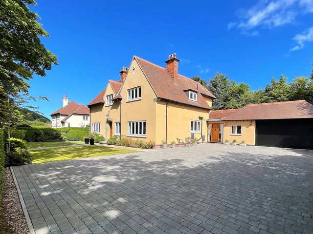 A large driveway leading up to the house and double garage provides plenty of parking space.