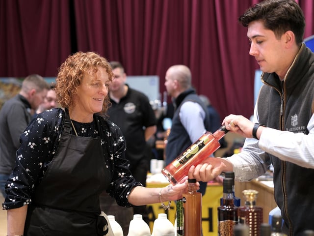 Checking the offerings at the Raisthorpe Manor stall