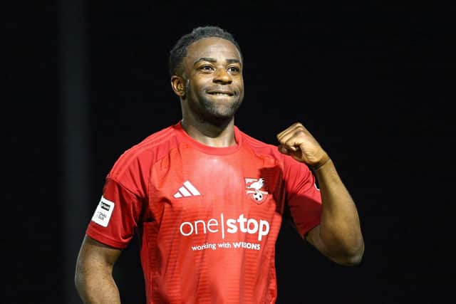 Kieran Weledji celebrates the 2-1 win against Buxton after the final whistle at Queensgate. Photo by Zach Forster