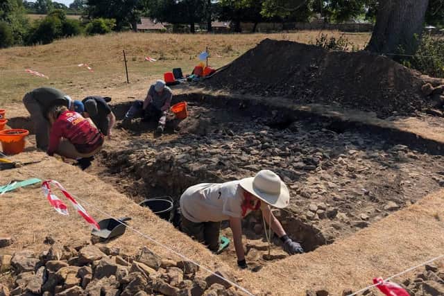 Participants working on the medieval stone feature - Image: Ethos Heritage CIC