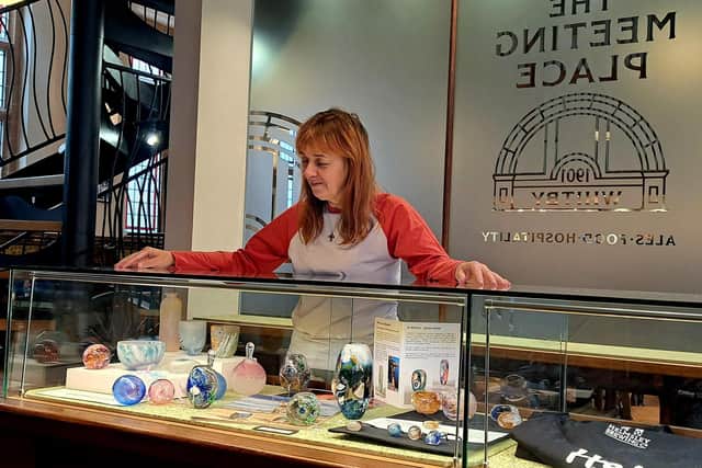 Glass artist Jo Kenny with her work at the Meeting Place in Whitby.