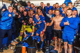 Whitby Town players and staff celebrate their FA Cup fourth qualifying round replay win at home to Chelmsford City. PHOTOS BY BRIAN MURFIELD