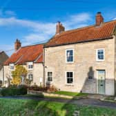 The Georgian house stands well within the village of Thornton le Dale.