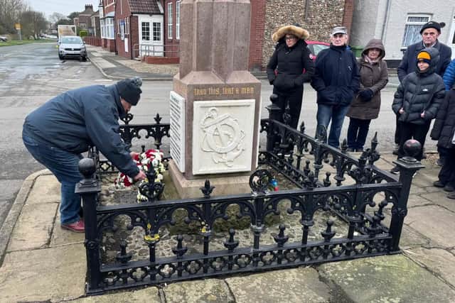 Neil Brooke, Flamborough Fishermen's Memorial Group, lays a wreath at the service. Photo: Mark Smales