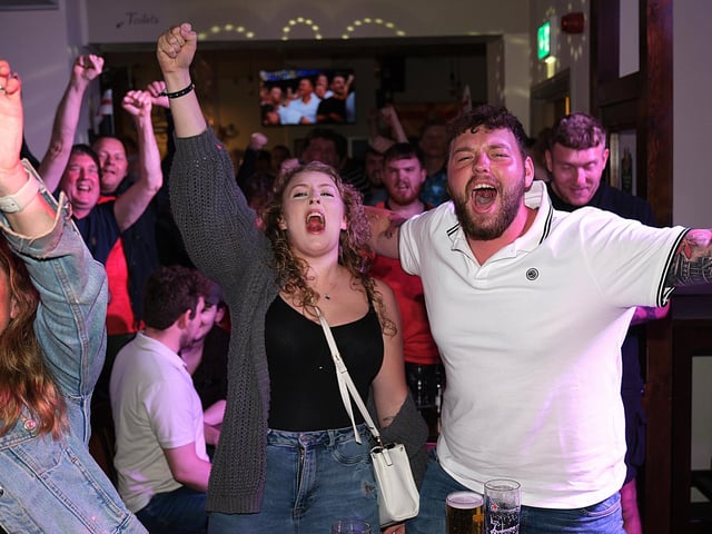 Celebrating an England goal at Dickens Bar. photo: Richard Ponter