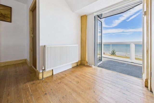The opening to the first floor balcony from the landing.