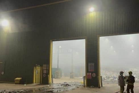 Firefighters deal with the fire in the waste transfer station at Carnaby Household Waste Recycling Site.