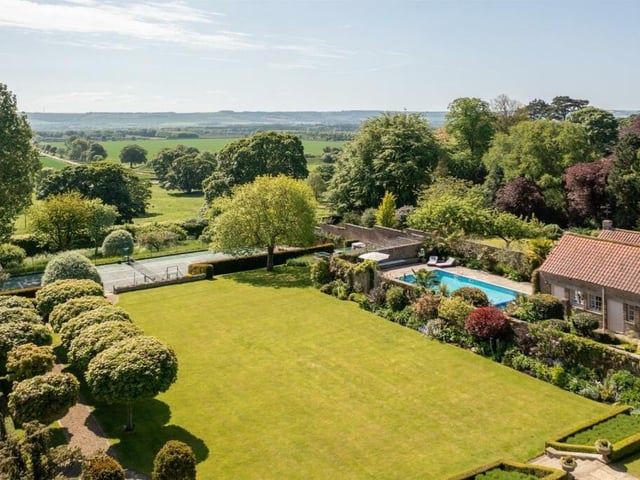 Looking over the gardens and grounds to the countryside stretching beyond.