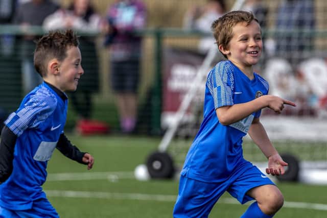 Bobby Stewart celebrates one of his goals for Whitby Fishermen's Society U7s against Grangetown Boys. Photo by Brian Murfield